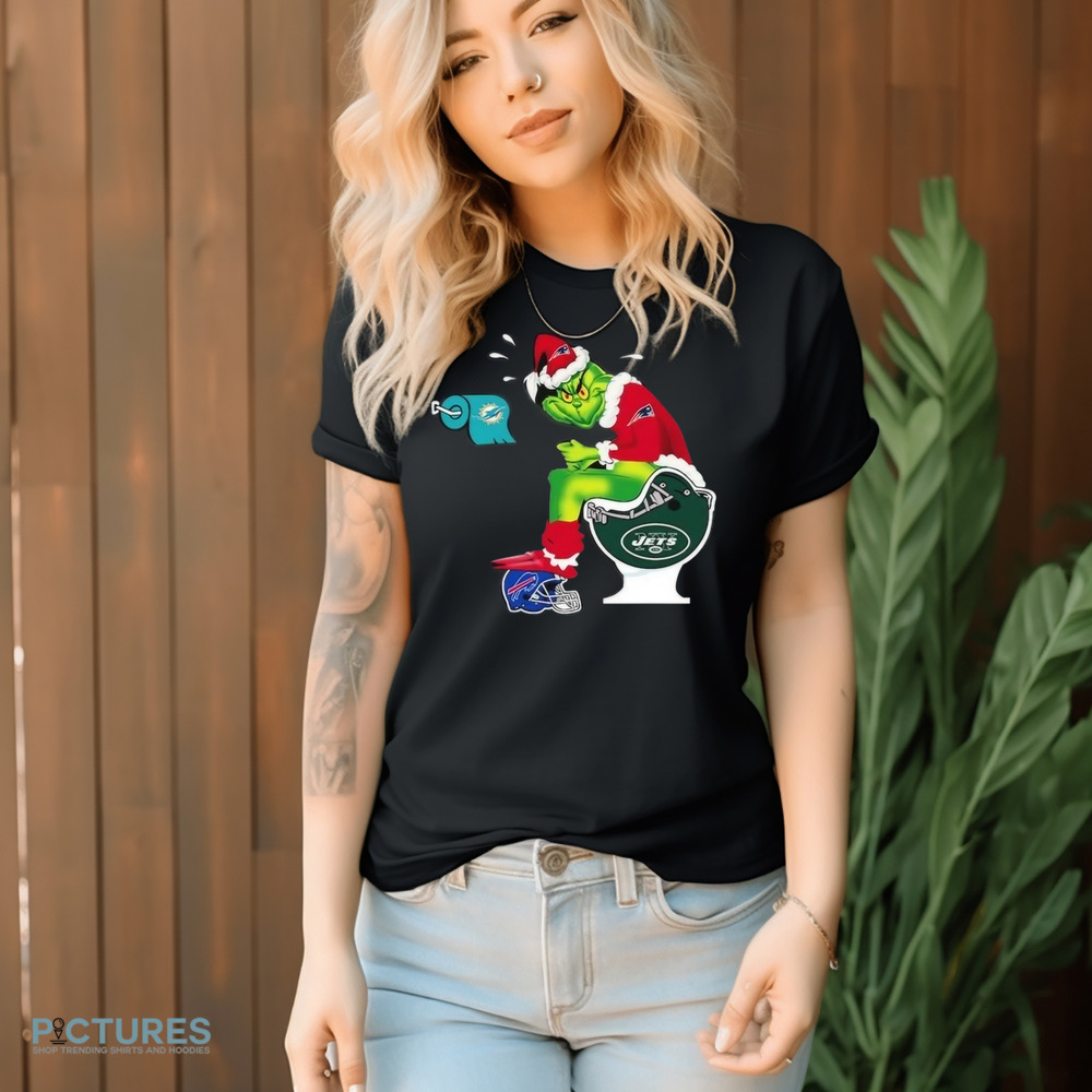 The Grinch Sitting On A Toilet Wearing A New England Patriot Toilet Miami Dolphins New York Jets Christmas Shirt