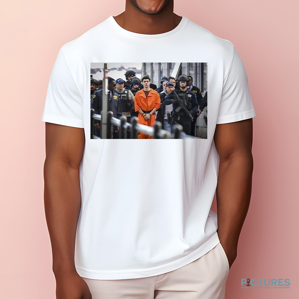 Luigi Mangione Arrives At A Helicopter Pad With Police New York Shirt