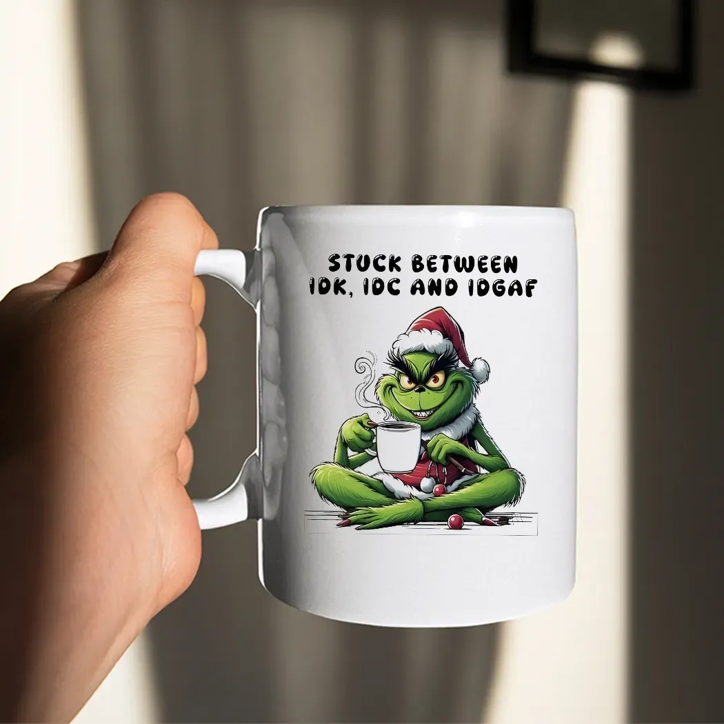 Grinch Stuck Between Idk Idc And Idgaf Christmas 2025 T Shirt