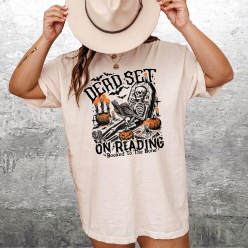 Dead Set On Reading Booked To The Bone Skeleton Spooky Halloween Graphic Tee