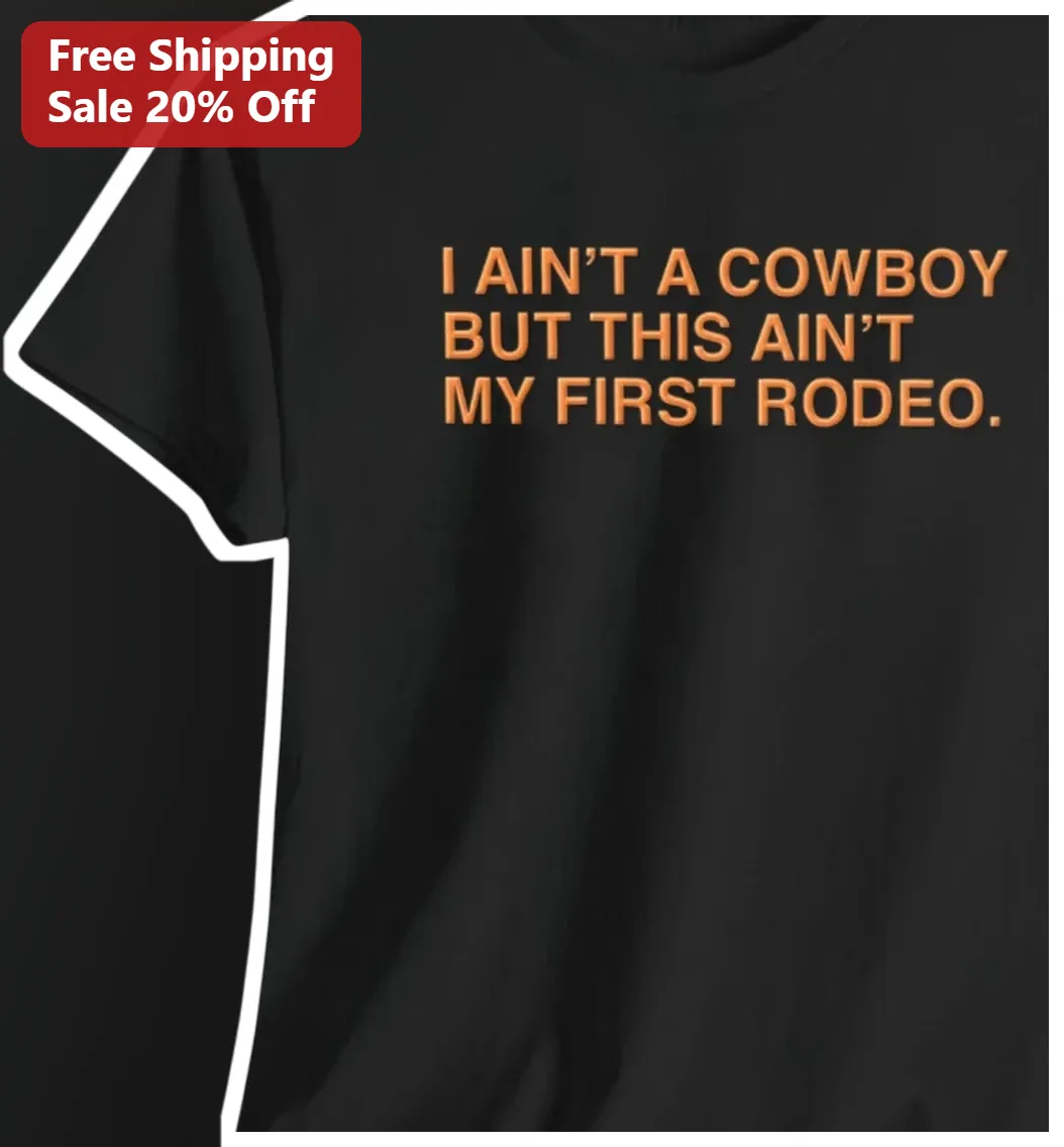 I AIN'T A COWBOY But This AIN'T My First Rodeo Graphic Tee Western Country Humor Shirt