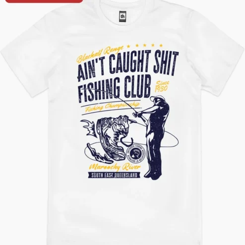 Ain't Caught Shit Fishing Club Tee Funny Angler Gift Shirt for Men on a hanger, ready to ship from Chicago, Illinois