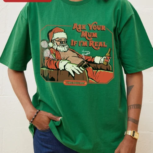 Customer in Chicago, Illinois wearing Ask Your Mum If I'm Real Tee Funny Santa Claus Graphic Shirt for Adults