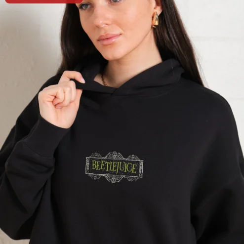 Customer in Chicago, Illinois wearing Beetlejuice Vintage Logo Graphic Hoodie Horror Movie Fan Merch Unisex Sweatshirt