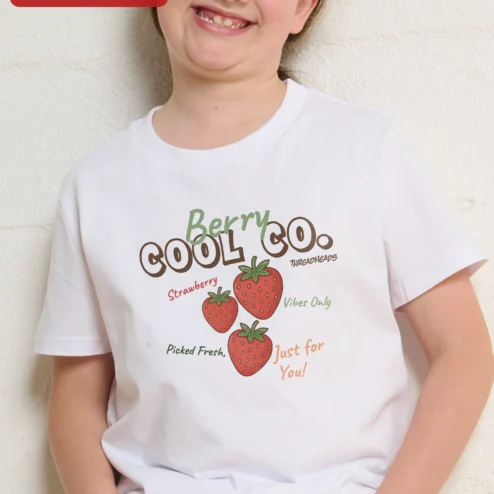 Customer in Chicago, Illinois wearing Berry Cool Co. Tee Funny Strawberry Graphic Kids Cotton Shirt