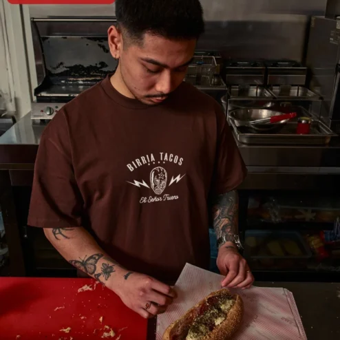 Customer in Chicago, Illinois wearing Birria Tacos El Senor Trueno Graphic Tee Mexican Foodie Gift Lucha Libre Shirt