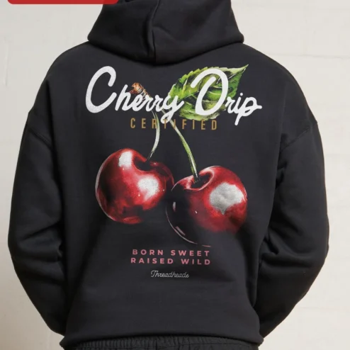 Close-up of Black Cherry Graphic Pullover Hoodie Minimalist Red Cherries Chest Print Streetwear Apparel for streetwear fans in Chicago, Illinois