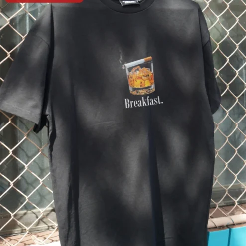 Breakfast. Funny Whiskey Cigarette Graphic Tee for Adults on a hanger, ready to ship from Chicago, Illinois