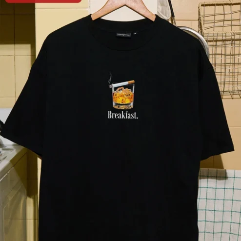 Breakfast. Whiskey and Cigarette Graphic Tee for Adults on a hanger, ready to ship from Chicago, Illinois