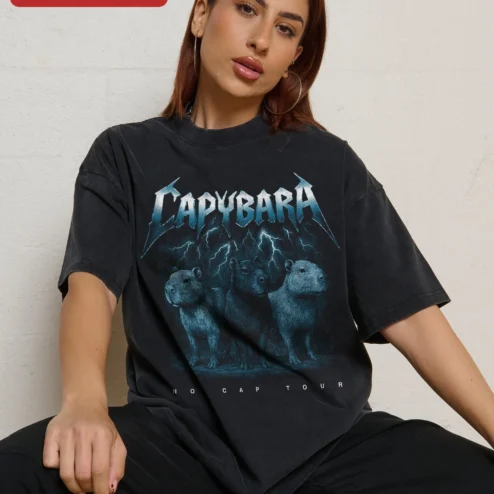 Capybara Heavy Metal Band Logo Graphic Tee Acid Wash Vintage Funny Animal Shirt on a hanger, ready to ship from Chicago, Illinois