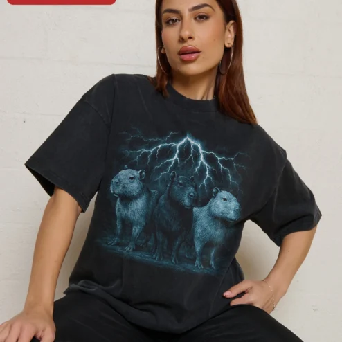 Customer in Chicago, Illinois wearing Capybara Lightning Storm Tee Surreal Animal Graphic Shirt for Men Women Gift