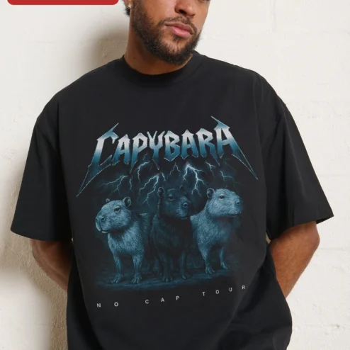 Capybara No Cap Tour Graphic Tee Funny Heavy Metal Parody Shirt For Animal Lovers on a hanger, ready to ship from Chicago, Illinois