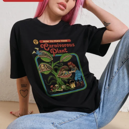 Customer in Chicago, Illinois wearing Carnivorous Plant How To Feed Your Venus Flytrap Graphic Tee Funny Botanical Humor Shirt for Plant L