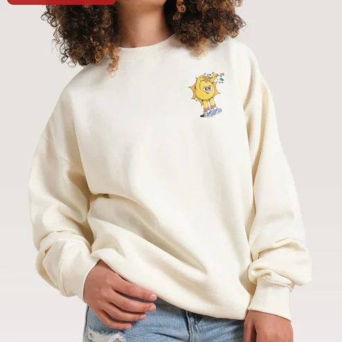 Close-up of Cartoon Sun Character Sweatshirt Cute Yellow Smiley Crewneck for Women Men Kids Cozy Fall Gift for streetwear fans in Chicago, Illinois
