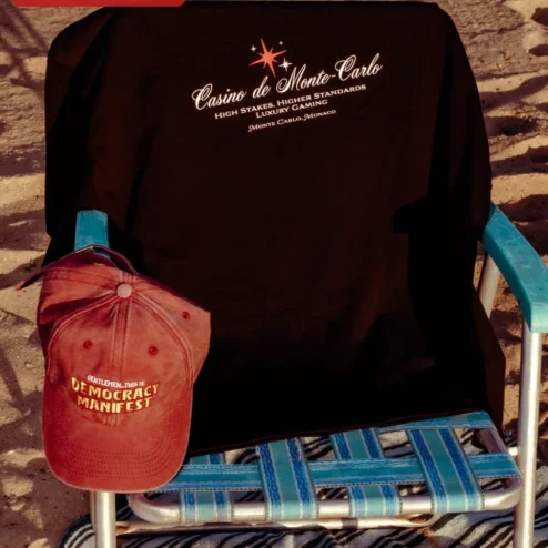 Casino de Monte-Carlo High Stakes Higher Standards Luxury Gaming Tee Monaco Travel Souvenir Shirt on a hanger, ready to ship from Chicago, Illinois