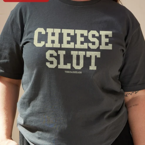 Close-up of Cheese Slut Funny Cheese Lover Tee Vintage Collegiate Graphic T-Shirt for Foodies for streetwear fans in Chicago, Illinois