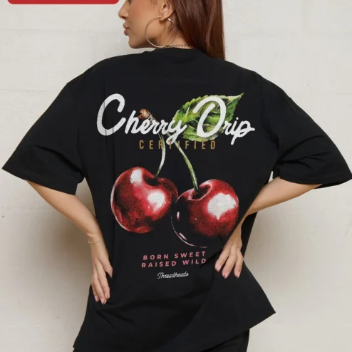 Close-up of Cherry Graphic Tee Oversized Black Cotton Shirt Minimalist Red Cherry Print Streetwear Apparel for W for streetwear fans in Chicago, Illinois