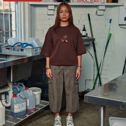 Customer in Chicago, Illinois wearing Cherry Graphic Tee Oversized Black Cotton Shirt Minimalist Red Cherry Print Streetwear Apparel for W
