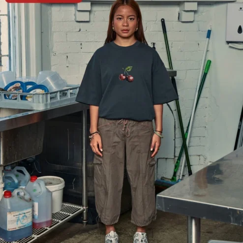 Customer in Chicago, Illinois wearing Cherry Graphic Tee Oversized Black Cotton Shirt Minimalist Red Cherry Print Streetwear Apparel for W