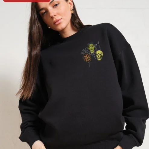 Customer in Chicago, Illinois wearing Classic Monsters Halloween Sweatshirt Vintage Vampire Werewolf Skull Crewneck Spooky Horror Gift