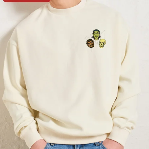 Close-up of Classic Monsters Halloween Sweatshirt Vintage Vampire Werewolf Skull Crewneck Spooky Horror Gift for streetwear fans in Chicago, Illinois
