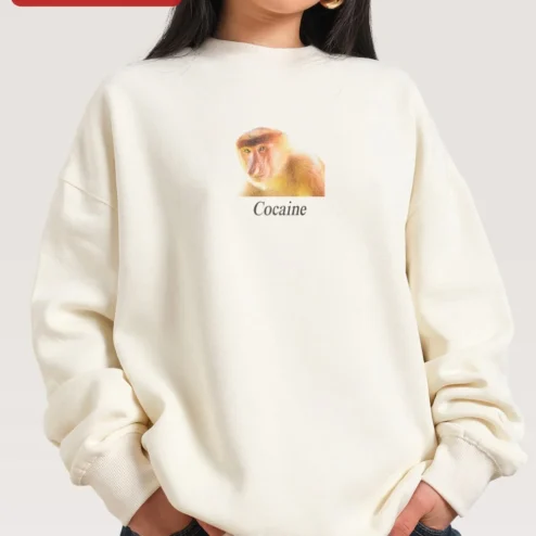 Cocaine Sweatshirt Proboscis Monkey Meme Graphic Crewneck Edgy Streetwear on a hanger, ready to ship from Chicago, Illinois