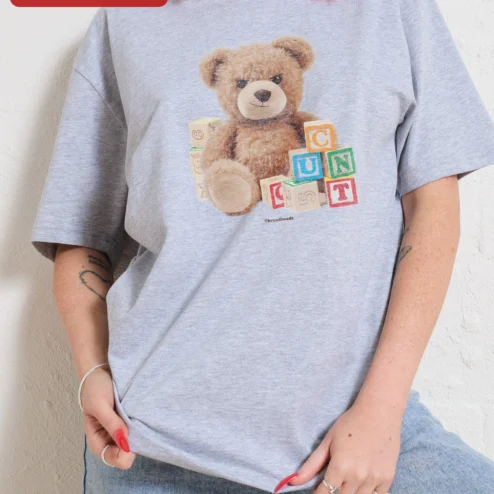 CONCUT Tee Spell It Out Grumpy Teddy Bear Streetwear Graphic T-Shirt on a hanger, ready to ship from Chicago, Illinois
