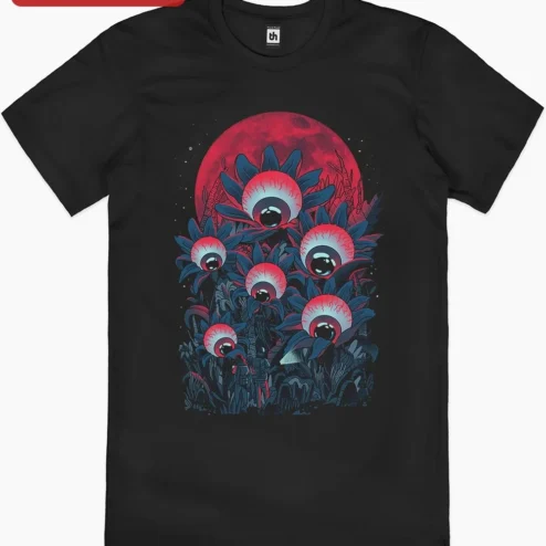 Creepy Eyeball Flowers Horror Illustration Tee Surreal Forest Night Hiking Graphic Shirt on a hanger, ready to ship from Chicago, Illinois