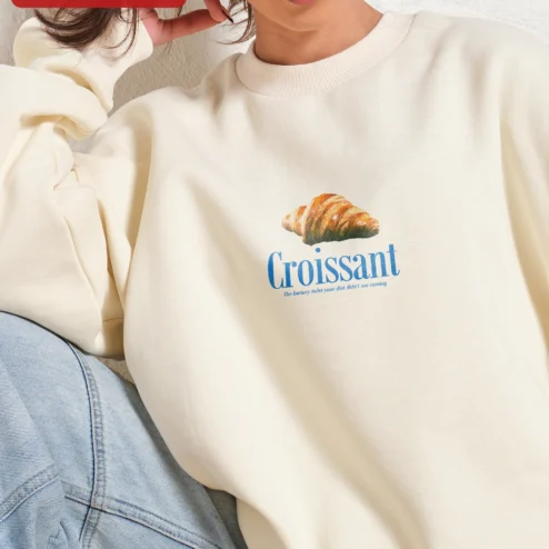Close-up of Croissant The Buttery Twist Your Diet Didn't See Coming Funny Foodie Sweatshirt for streetwear fans in Chicago, Illinois