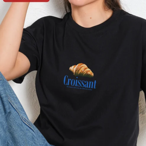 Croissant The Buttery Twist Your Diet Didn't See Coming Graphic Tee Funny Foodie Gift Shirt on a hanger, ready to ship from Chicago, Illinois