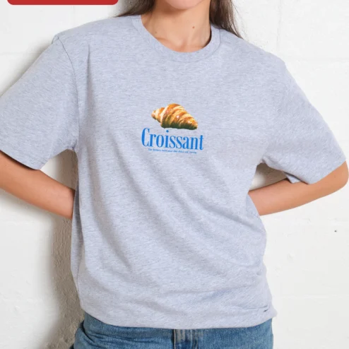 Customer in Chicago, Illinois wearing Croissant The Buttery Twist Your Diet Didn't See Coming Graphic Tee Funny Foodie Gift Shirt