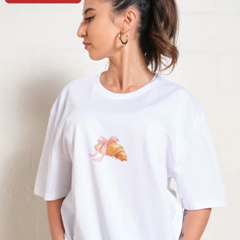 Customer in Chicago, Illinois wearing Croissant with Pink Bow Graphic Tee Cute French Pastry Shirt for Women