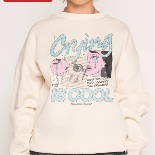Crying IS COOL Retro Collage Sweatshirt Mental Health Awareness Crewneck on a hanger, ready to ship from Chicago, Illinois