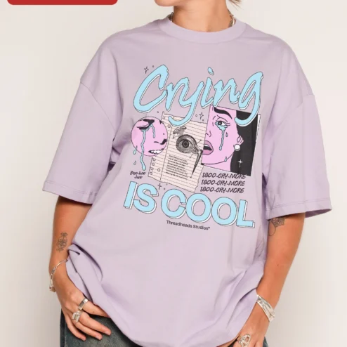 Crying Is Cool Tee Retro Collage Graphic Shirt for Gen Z Y2K Aesthetic on a hanger, ready to ship from Chicago, Illinois