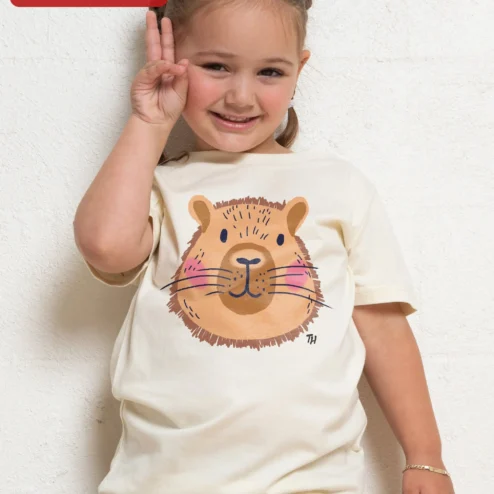 Cute Capybara Face Tee Kawaii Cartoon Graphic Shirt for Kids Animal Lovers Gift on a hanger, ready to ship from Chicago, Illinois