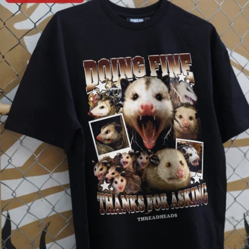 Customer in Chicago, Illinois wearing Doing Fine Thanks For Asking Opossum Graphic Tee Sarcastic Mental Health Humor Shirt