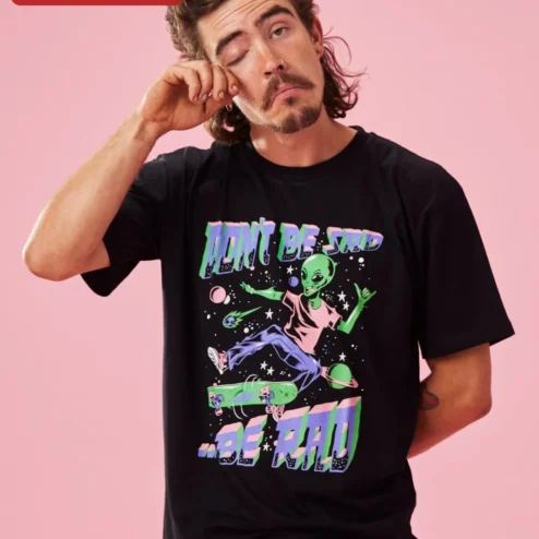 Customer in Chicago, Illinois wearing Don't Be Sad Be Rad Alien Skateboarding Graphic Tee Retro Space Humor Shirt