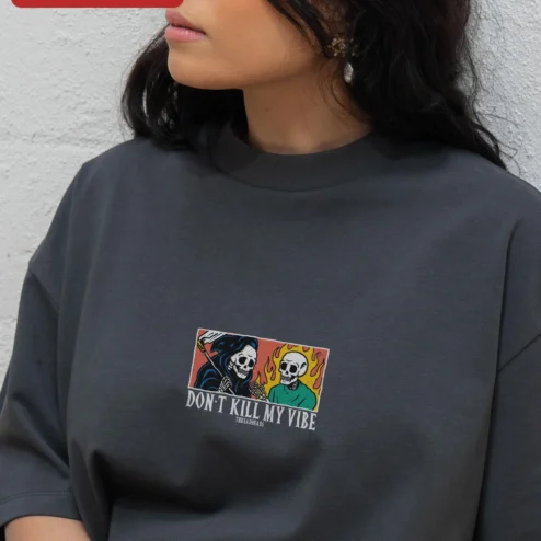 Don't Kill My Vibe Graphic Tee Gothic Grim Reaper Skeleton Alt Streetwear Shirt on a hanger, ready to ship from Chicago, Illinois