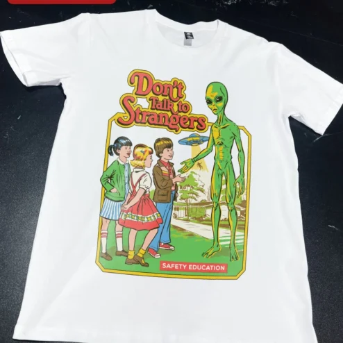 Customer in Chicago, Illinois wearing Don't Talk to Strangers Safety Education Retro Alien Graphic Tee