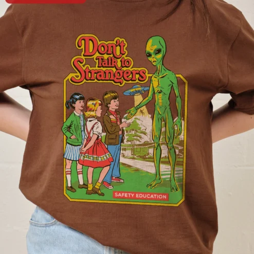 Customer in Chicago, Illinois wearing Don't Talk to Strangers Safety Education Retro Alien Graphic Tee