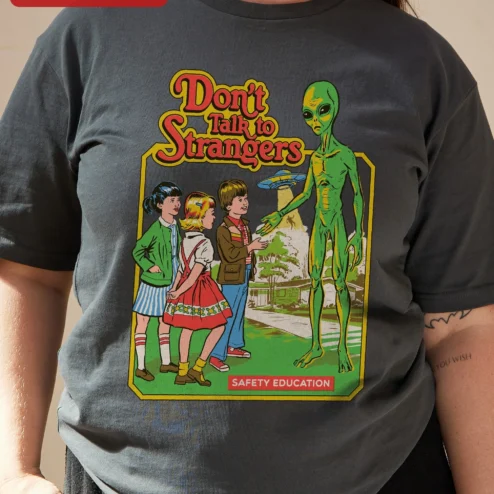 Close-up of Don't Talk to Strangers Safety Education Retro Alien Graphic Tee for streetwear fans in Chicago, Illinois