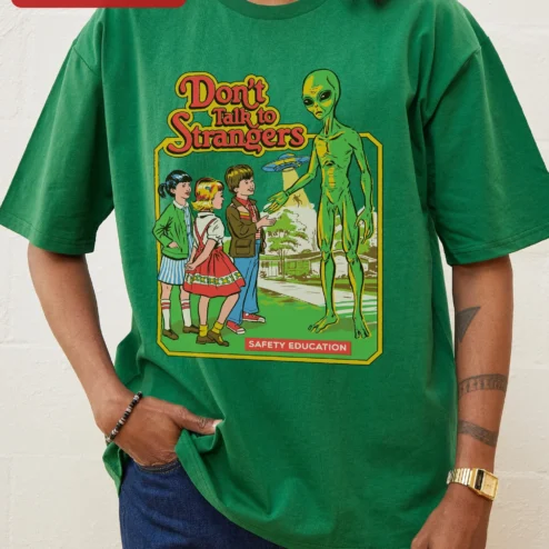 Customer in Chicago, Illinois wearing Don't Talk to Strangers Safety Education Retro Alien Graphic Tee