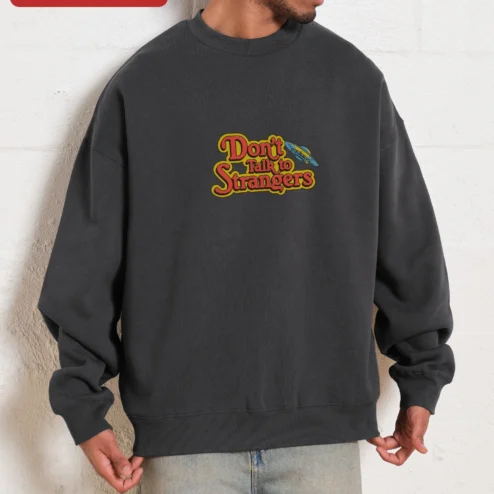 Close-up of Don't Talk to Strangers Sweatshirt Retro 80s Music Fan Apparel Unisex Crewneck for streetwear fans in Chicago, Illinois