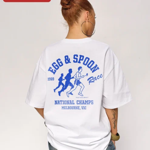 Customer in Chicago, Illinois wearing Egg Spoon Race National Champs Melbourne VIC Retro Graphic Tee
