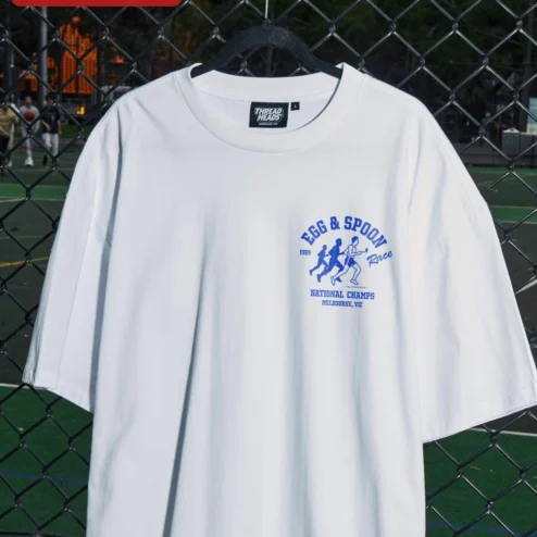 Egg Spoon Race National Champs Tee Funny Field Day Graphic Shirt for Women Men on a hanger, ready to ship from Chicago, Illinois