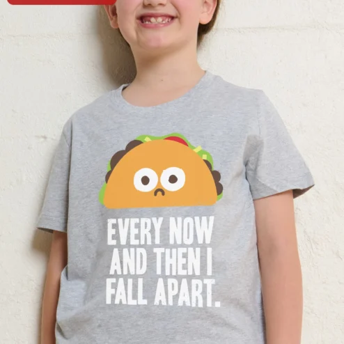 Every Now And Then I Fall Apart Sad Taco Kids Tee Funny Cartoon Food Pun Shirt on a hanger, ready to ship from Chicago, Illinois