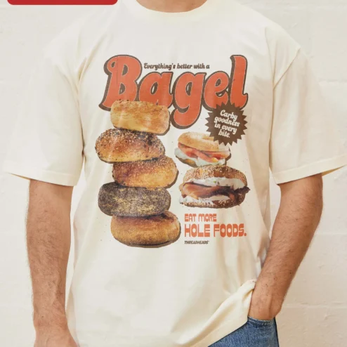 Customer in Chicago, Illinois wearing Everything's Better With A Bagel Eat More Hole Foods Funny Food Pun Retro Ringer Tee