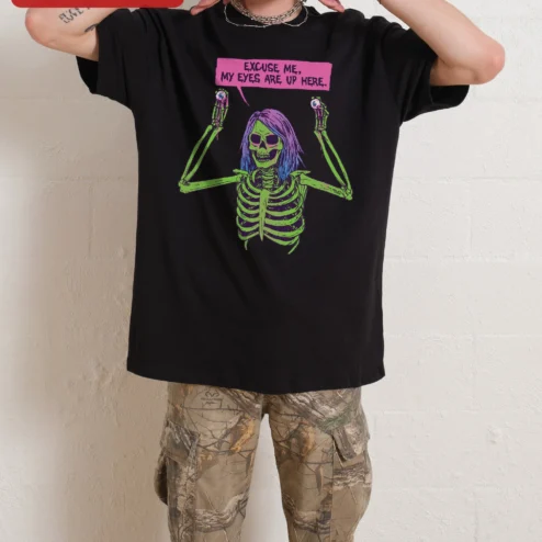 Excuse Me My Eyes Are Up Here Skeleton Graphic Tee Funny Halloween Spooky Humor Shirt for Women on a hanger, ready to ship from Chicago, Illinois
