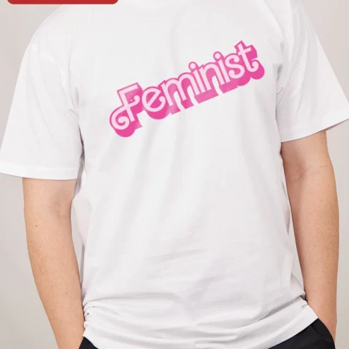 Feminist Tee Retro Y2K Pink Typography Statement Shirt for Women on a hanger, ready to ship from Chicago, Illinois