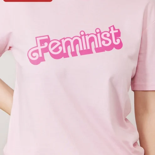Customer in Chicago, Illinois wearing Feminist Tee Retro Y2K Pink Typography Statement Shirt for Women